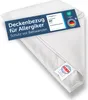 A white duvet cover is folded and displayed on a white background, with product information tags attached. Voir les images du produit
