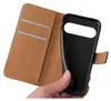 A hand holding an open black flip phone case with brown interior card slots. Produktbild-Vorschau