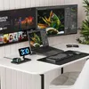 A desk setup with multiple monitors, a laptop, and charging accessories. Voir les images du produit