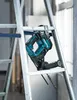 A power drill is hanging on a ladder. Produktbild-Vorschau
