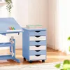 A blue and white roll container with drawers next to a blue desk. Produktbild-Vorschau