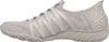 Side view of a beige and gray Skechers slip-on sneaker. Náhled obrázku produktu