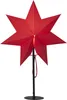 A red star-shaped lamp on a black stand. Podgląd zdjęcia produktu