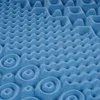 A close-up, abstract view of a blue foam mattress topper with a textured surface. Produktbild-Vorschau