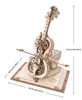 A 3D wooden model of a cello with intricate gears and a flower design, resting on an open book. Voir les images du produit
