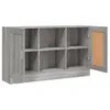 A grey wooden sideboard with multiple open compartments and one closed compartment with a glass door. The sideboard is shown from the front with the glass door ajar. Voir les images du produit