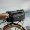 A bicycle saddlebag with a water bottle attached, mounted on a bicycle rack. Anteprima dell’immagine prodotto