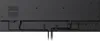 The back of a black electronic device, likely a TV or monitor, showing ports and cable management. Voir les images du produit