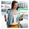 A woman walking outdoors while looking at her phone, with marketing overlays about security features. Produktbild-Vorschau