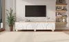 A modern living room with a TV stand and a large television mounted on the wall. Voir les images du produit