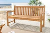 A wooden bench on a deck overlooking a beach. Produktbild-Vorschau
