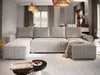 A modern living room with a large sectional sofa, coffee table, and decorative elements. Produktbild-Vorschau