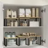 A kitchen cabinet interior with shelves holding various kitchen items. Anteprima dell’immagine prodotto