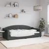 A dark gray daybed with white bedding is shown in a room with white walls and shelves. Náhled obrázku produktu
