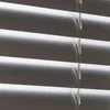 A close-up view of horizontal blinds. Produktbild-Vorschau