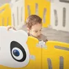 A baby is playing inside a colorful playpen. Produktbild-Vorschau