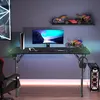 A gaming desk setup in a room with LED lighting. Produktbild-Vorschau