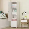 A white modular storage cabinet with multiple shelves and doors, partially open, filled with folded clothes and bags. A side table with a lamp and a plant is next to it. Anteprima dell’immagine prodotto