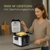 A woman is using a deep fryer filled with french fries on a kitchen counter. A wooden cutting board is visible in the background. Produktbild-Vorschau