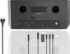 The back panel of a black Hama DAB radio is shown, along with various cables and accessories laid out below it. Produktbild-Vorschau