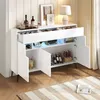 A white sideboard with LED lighting, displaying various items like bottles, a lamp, and decorative frames. Voir les images du produit