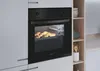 A built-in oven with a baking tray of croissants inside, placed in a modern kitchen setting next to a shelving unit. Náhľad obrázku produktu