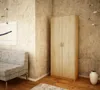 A bedroom corner with a wardrobe, sofa, and artwork. Náhled obrázku produktu