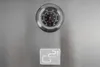 A close-up of a thermometer on a stainless steel surface, with a brand logo below it. Náhled obrázku produktu