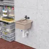 A sink and storage bins in a workshop or garage setting. Anteprima dell’immagine prodotto