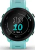 A close-up shot of a Garmin Forerunner 55 smartwatch with a turquoise band and black bezel, displaying the time and date on its screen. Podgląd zdjęcia produktu