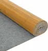 A rolled-up bamboo mat with a gray backing. Podgląd zdjęcia produktu