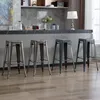 Four metal bar stools are arranged in a row in front of a kitchen counter. Náhľad obrázku produktu