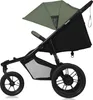 A three-wheeled jogging stroller with a green canopy and black frame, shown from the side against a white background. Náhled obrázku produktu