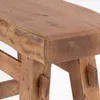 A close-up view of a wooden stool. Produktbild-Vorschau