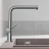 A modern kitchen faucet with water running into a sink. Produktbild-Vorschau