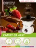 A chocolate fountain with strawberries, accompanied by product information. Podgląd zdjęcia produktu
