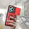 A hand holding a red phone case with a ring holder and a slide camera cover, with a blurred background of an interior. Produktbild-Vorschau