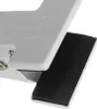A close-up view of a white desk lamp with a black padded clip. Náhled obrázku produktu