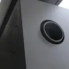 A close-up shot of a gray metal stove with a circular opening. Produktbild-Vorschau