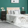 A bedroom scene with a bed, nightstand, and rug. Náhled obrázku produktu