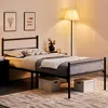 A bedroom scene with a bed, nightstand, lamp, and artwork. Voir les images du produit