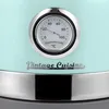 A close-up of a mint-colored kettle with a built-in thermometer and the brand name 'Vintage Cuisine'. Voir les images du produit