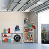 A garage interior with shelves stocked with various items including cleaning supplies, a fire extinguisher, a tire, and gardening tools. A garage door is open above. Produktbild-Vorschau