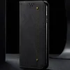 A black flip-style phone case is shown in a studio setting against a black background. Produktbild-Vorschau