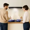 A couple cooking together in a modern kitchen, with a range hood above a stovetop. Náhľad obrázku produktu