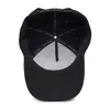 The inside of a black baseball cap is shown, with the brand name printed on the internal bands. Produktbild-Vorschau