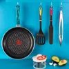 Kitchen utensils and ingredients displayed against a blue background. Produktbild-Vorschau