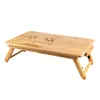 A wooden laptop table with foldable legs and ventilation holes. Produktbild-Vorschau