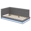 A grey upholstered bed frame with a tufted headboard and integrated LED lighting. Produktbild-Vorschau