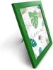 A green picture frame is shown at an angle against a white background. Produktbild-Vorschau